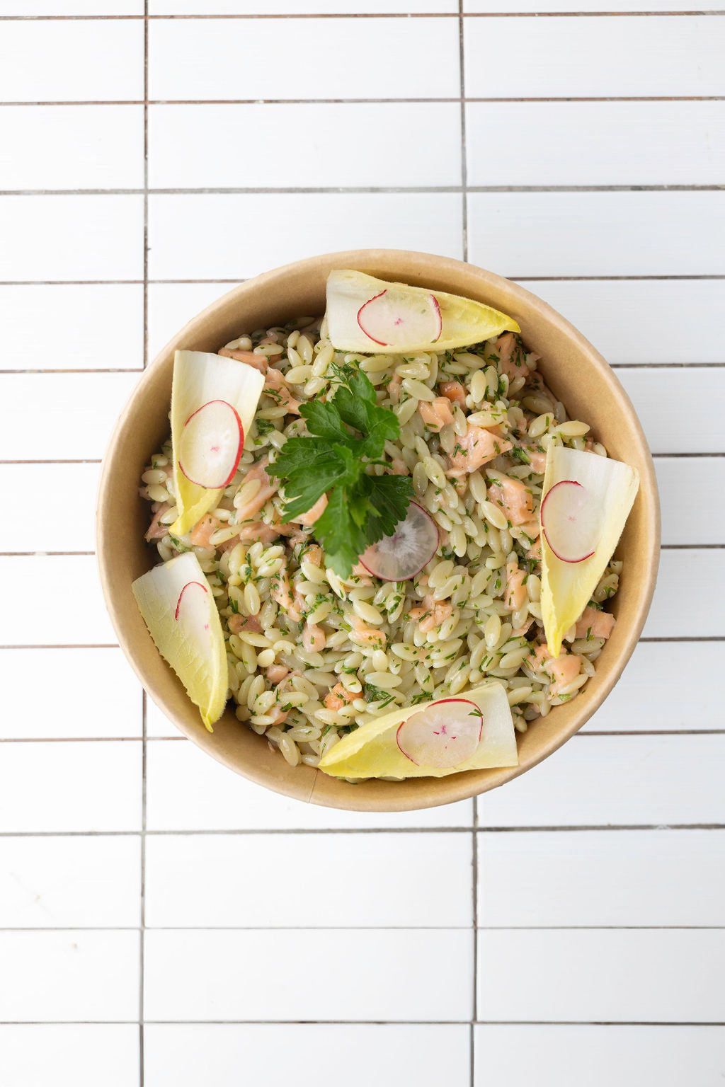 Greek pasta salad with smoked salmon and dill, radish